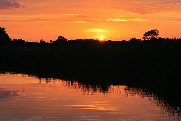 Norfolk Broads Setting Sun Reflection stock photo