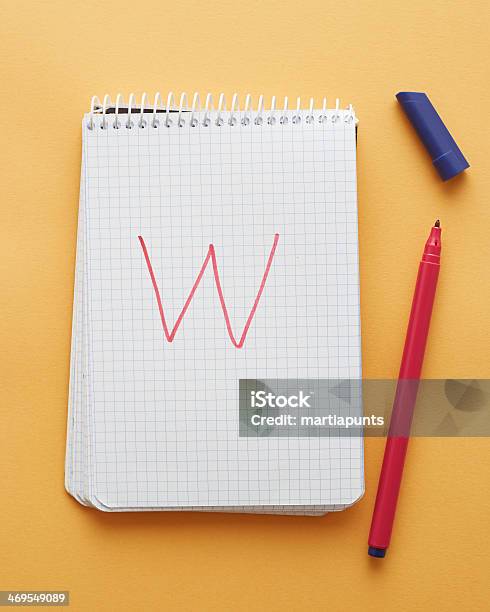 W Letter Handwritten In Notebook Stock Photo - Download Image Now - Above, Alphabet, Child