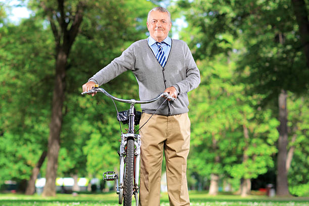 Mature man with his bicycle in a park