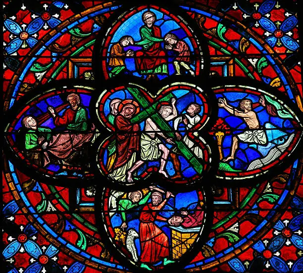 Stained glass window dating from the 13th Century in the Cathedral of Tours, France. This window depicts Jesus on the Via Dolorosa in the center.