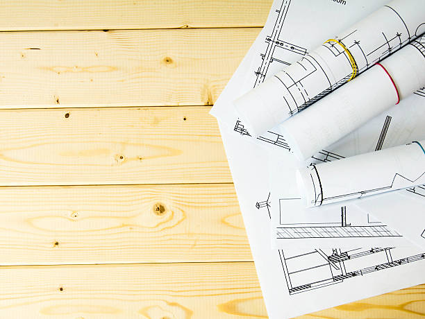 istock Many drawings for building on a wooden background 469550738