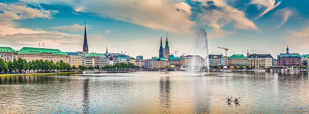 Hamburg skyline with Binnenalster (Inner Alster Lake) at sunset, Germany Panoramic view of famous Binnenalster (Inner Alster Lake) in golden evening light at sunset, Hamburg, Germany. hamburg stock pictures, royalty-free photos & images