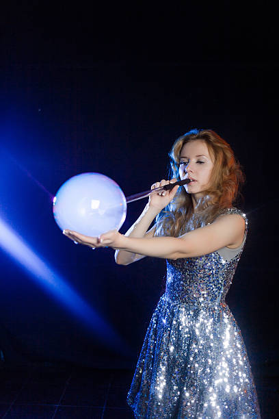 istock Girl is showing soap bubbles show 469551584