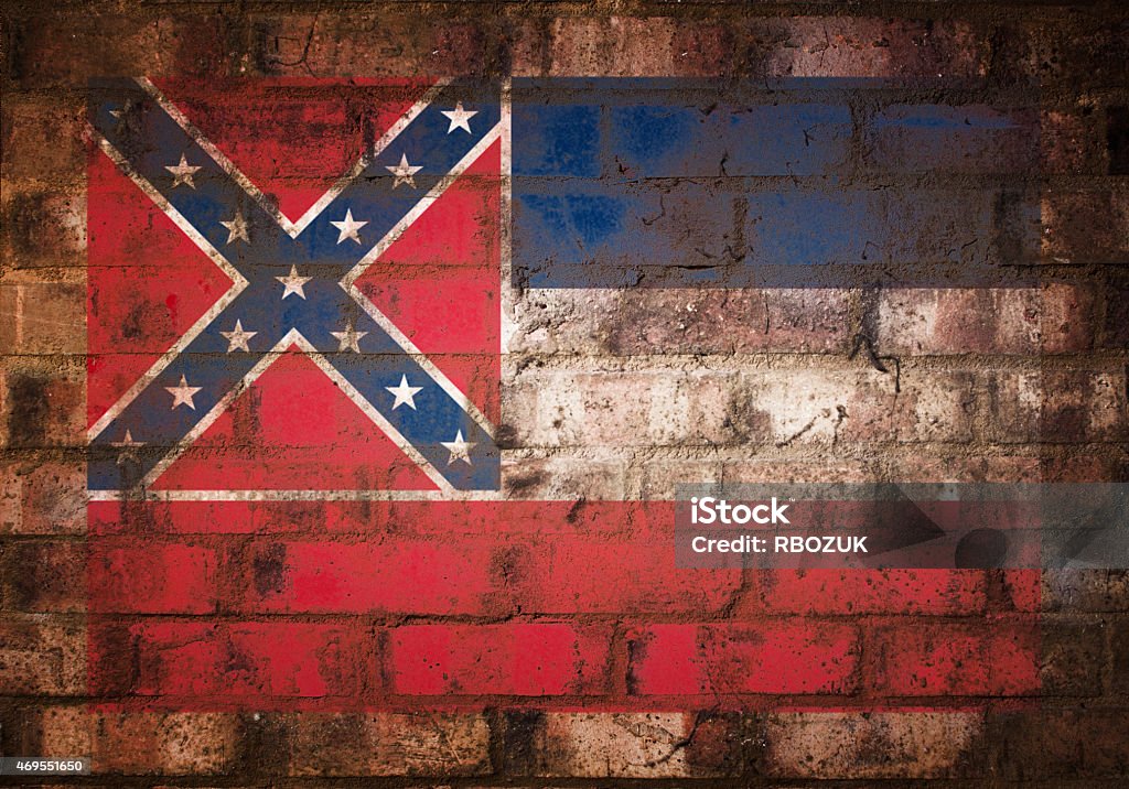 Flag of Mississippi on Rustic Brick Wall A stenciled American flag, shot with available light, on a rustic brick background.  2015 Stock Photo