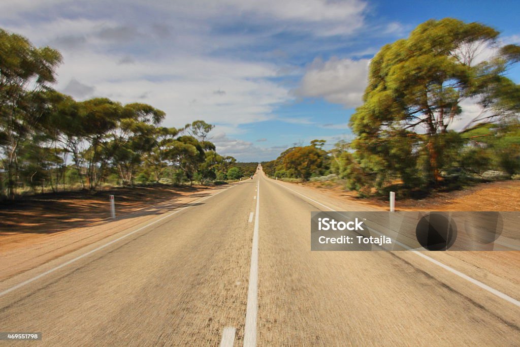 Endless roads in Australia Long road in the middle of nowhere. 2015 Stock Photo