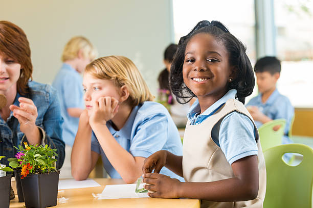 istock Elementary school age African American little girl in science class 469551800