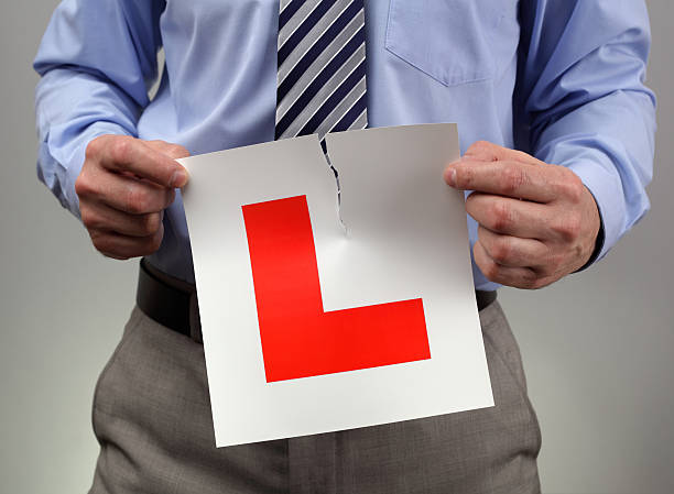 istock Tearing up L plate 469555061