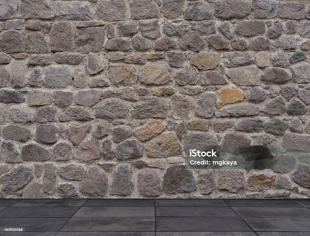 Stone Wall with Sidewalk Stone wall with sidewalk texture background image. 2015 Stock Photo
