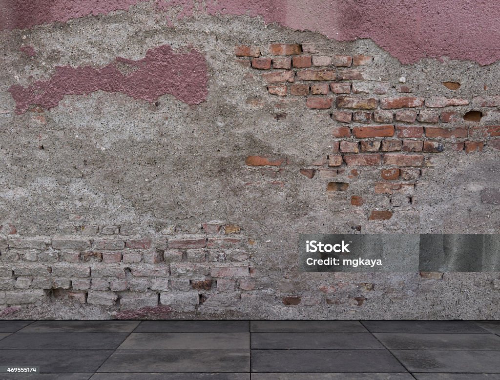 Broken Brick Wall with Sidewalk Broken brick wall with sidewalk texture background image. Brownstone Stock Photo