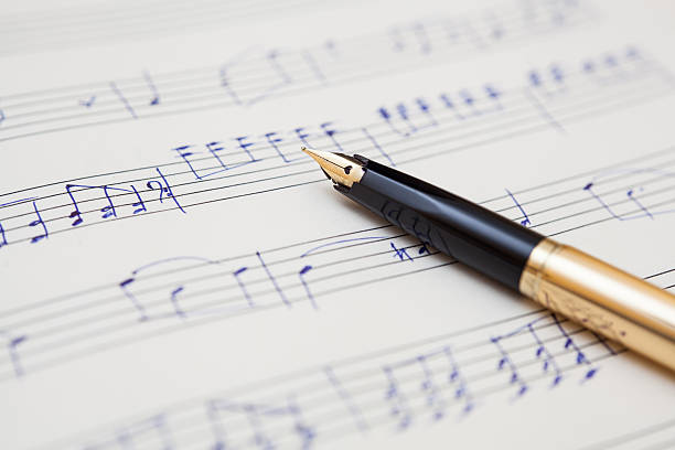 istock pen and music sheet with handwritten notes 469555425