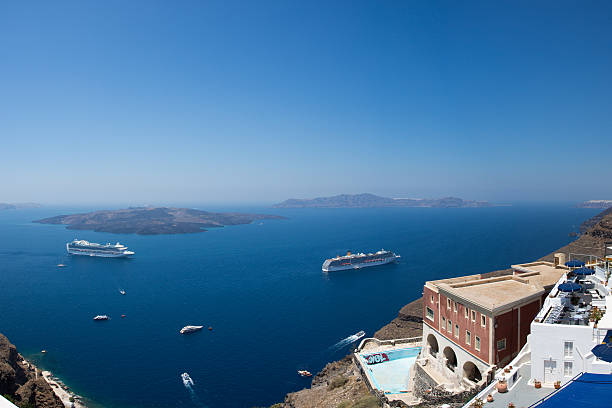 istock Two cruise ships and other boats in Santorini 469555439