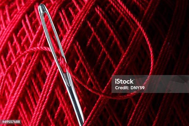 Close Up Of Needle Stuck Into Red Ball Of Thread Stock Photo - Download Image Now - 2015, Art And Craft, Close-up