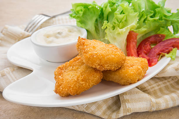 istock Fish nuggets and dip sauce on plate 469558946