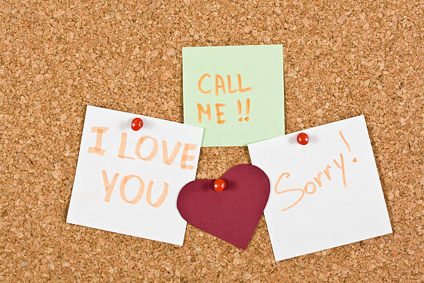 istock Love You Note pinned to a cork memory bulletin board. 469558970