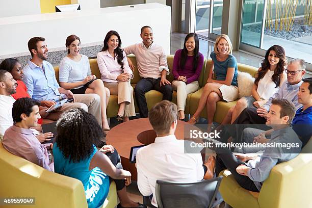 Multicultural Office Staff Sitting Having Meeting Together Stock Photo - Download Image Now