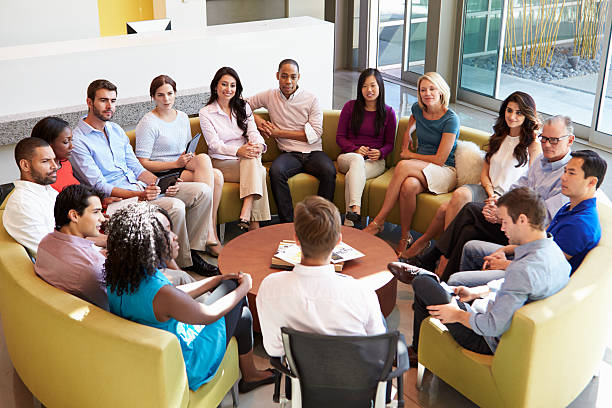 istock Multi-Cultural Office Staff Sitting Having Meeting Together 469559183