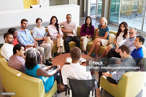 Multicultural Office Staff Sitting Having Meeting Together Stock Photo - Download Image Now