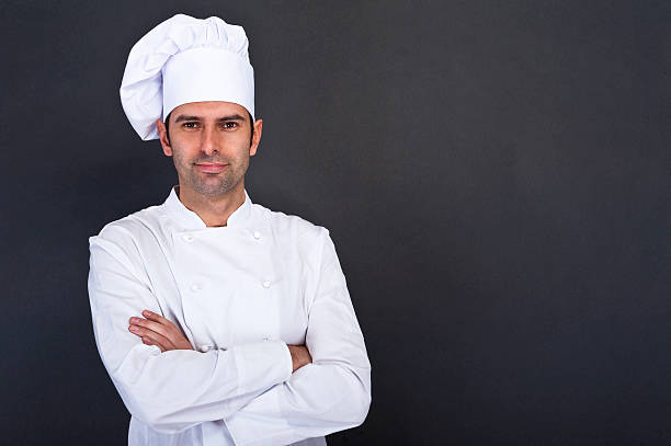 Male chef portrait against grey background stock photo