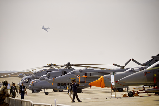 Bangalore, Karnataka, India - February 20, 2015: The tenth edition of Aero India was held from 18th to 22nd February 2015. The main attraction of this year was the Make in India campaign by Prime Minister Narendra Modi. A total of 72 aircraft were part of the air show. The main attraction of the event was the fly past and demonstration by HAL Tejas, HAL Light Combat Helicopter, Sarang display team and air display teams from Sweden, UK, Czech Republic and Open sky jump by US Special forces. A total of 11 foreign military aircraft on display, out of which a majority of them from the United states including two F-15C Eagles, two F-16C Fighting Falcons, one Boeing KC-135 tanker, one C-17 Globemaster III and a P-8A Poseidon maritime surveillance aircraft.