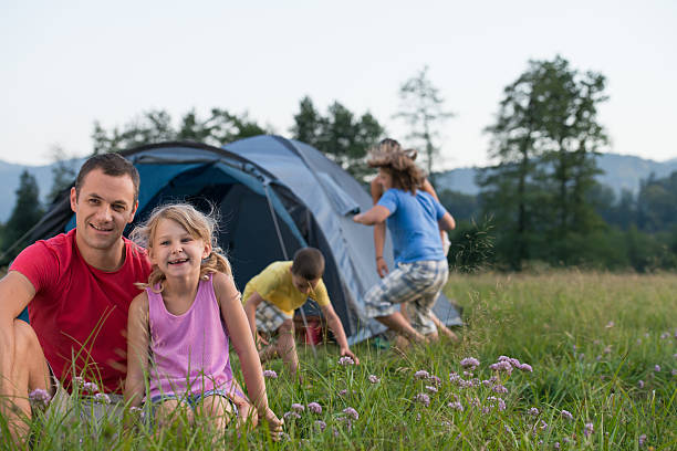istock Family camping, having fun in the nature. 469563825