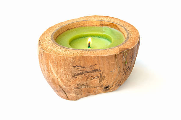 istock green Candle in a coconut shell 469563951