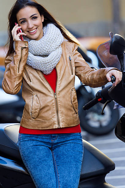 istock Young woman talking on mobile in the city 469564207