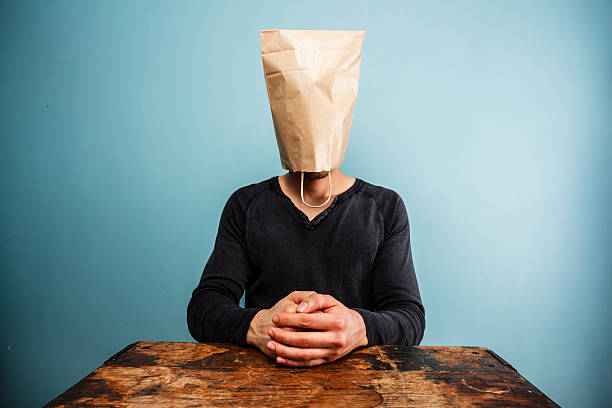 istock calm and relaxed man with bag over head 469566813
