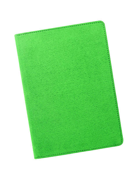 istock Green velvet notebook isolated on white background 469567427