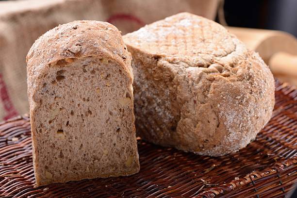 istock Traditional bread on old wooden basket 469568030
