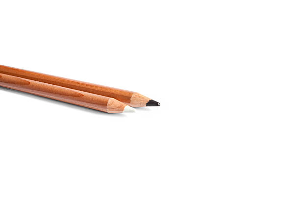 istock Black and white pencils in white background 469568382