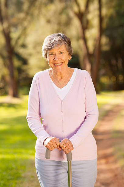 istock happy senior woman outdoors in forest 469568707