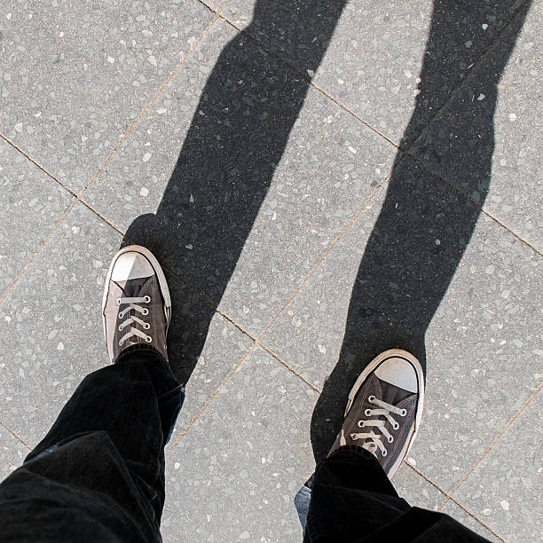 istock People shoes standing on the asphalt 469569046