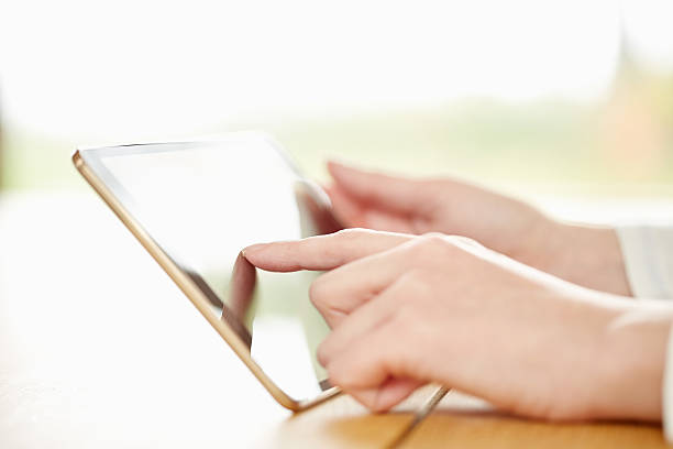 istock Cropped image of finger touching digital tablet 469571682