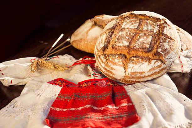 istock Rustic bread and wheat on a traditional girl costume 469572006