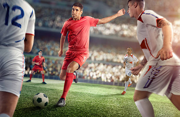 istock Soccer player kicking ball in stadium 469572350