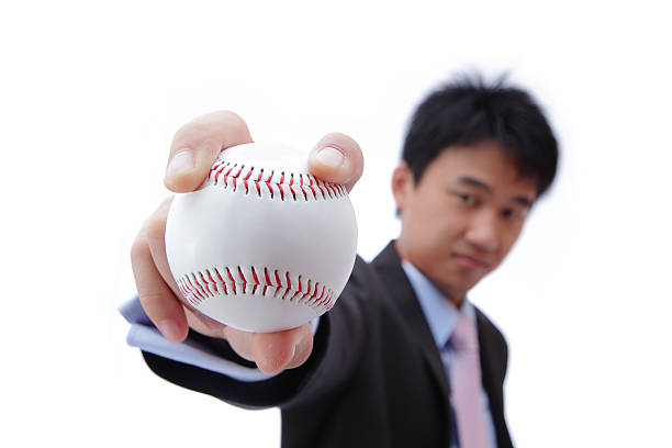 istock Business man take baseball 469572567