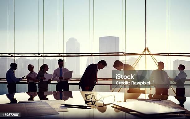 Group Of Business People Discussing In The Office Stock Photo - Download Image Now - Bowing, Japan, Asian and Indian Ethnicities