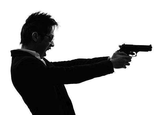 istock asian gunman killer portrait shooting silhouette 469573343