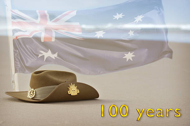 istock Anzac Day slouch hat on beach with Australian flag 469574524