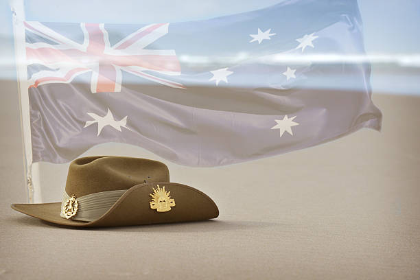 Anzac Day slouch hat on beach with Australian flag