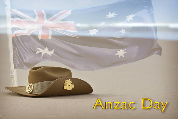 istock Anzac Day slouch hat on beach with Australian flag 469574584