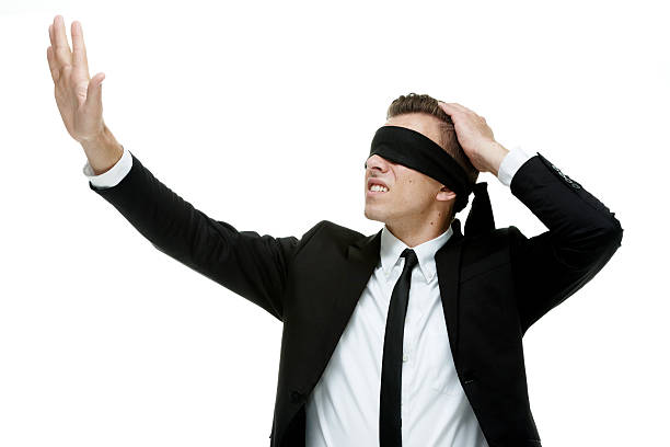istock Blindfold businessman searching 469574924