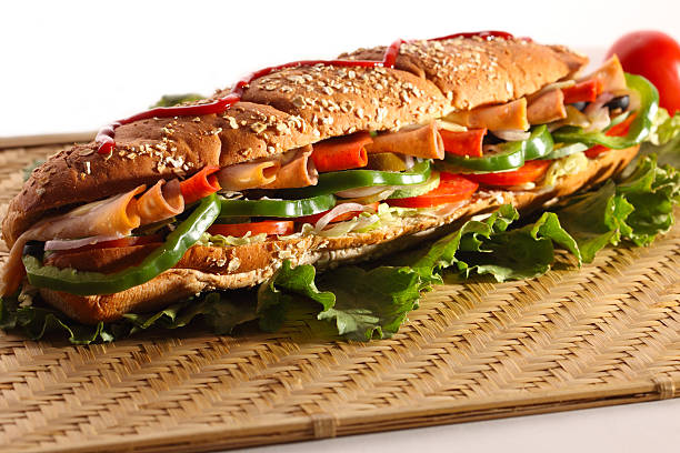 istock Chicken and Turkey Ham Sandwich with vegetables, brown bread 469576731