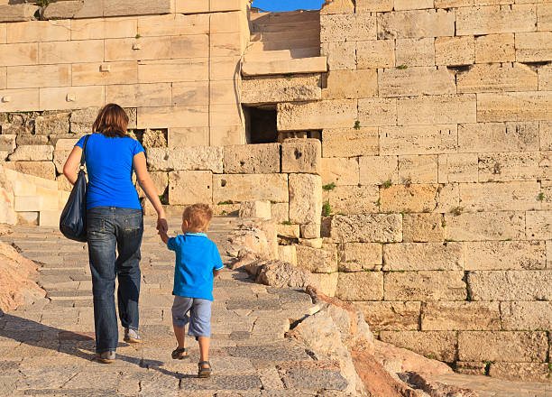 istock family walking in Acropolis, Greece 469579695