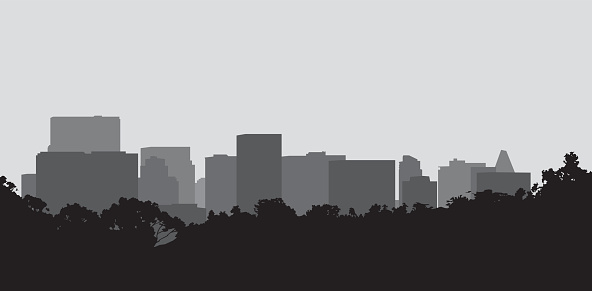 Vector silhouette of city buildings behind a line of trees and bushes.