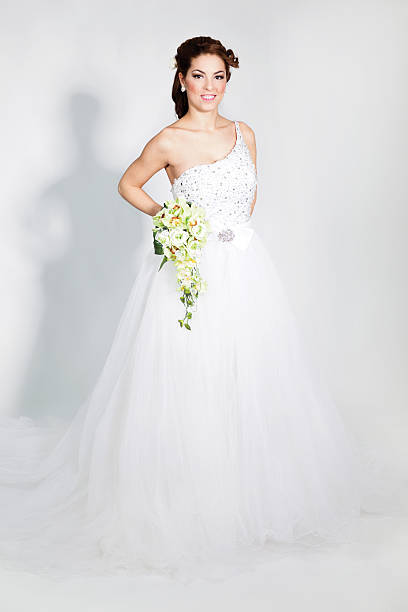 istock beautiful elegant bride in a white wedding dress posing 469582615