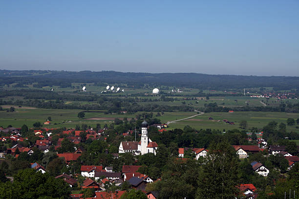 view to village pähl and the parabols of telekom view to village Paehl near ammersee in bavaria in backround are the parabols for communication germany parabol stock pictures, royalty-free photos & images