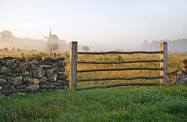 Limestone fence and misty landscape.TN