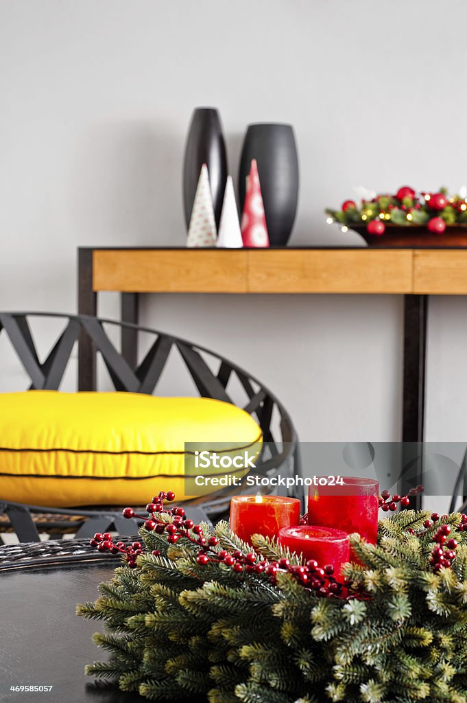 metal sofa with yellow pillow Metal sofa with yellow pillow in advent decoration Beige Stock Photo