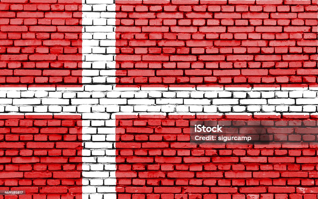 Bandeira Dinamarquesa em uma parede de tijolos. - Foto de stock de Bandeira royalty-free